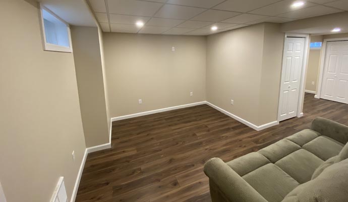 Finished basement with modern lighting and flooring