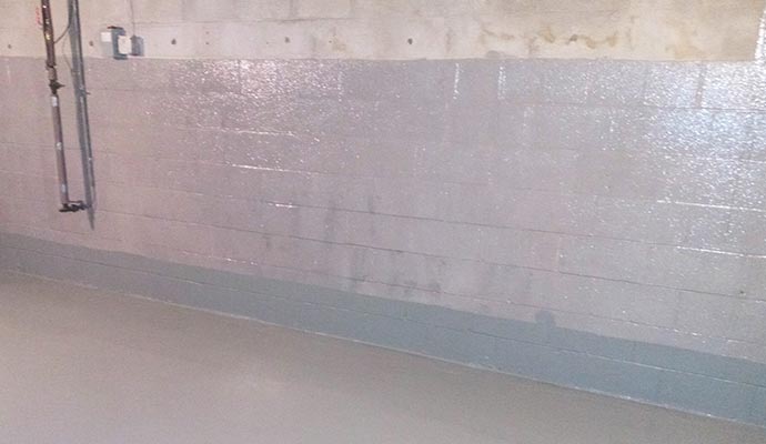 Newly waterproofed basement wall