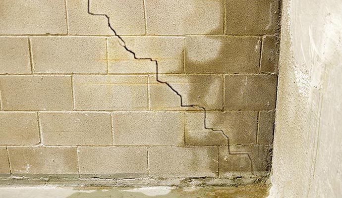 Cracked foundation wall with moisture