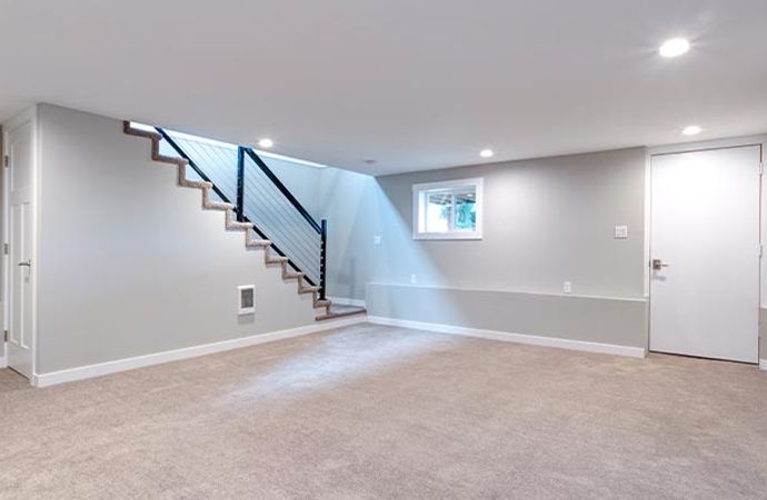  Professionally finished basement with clean flooring and bright lighting