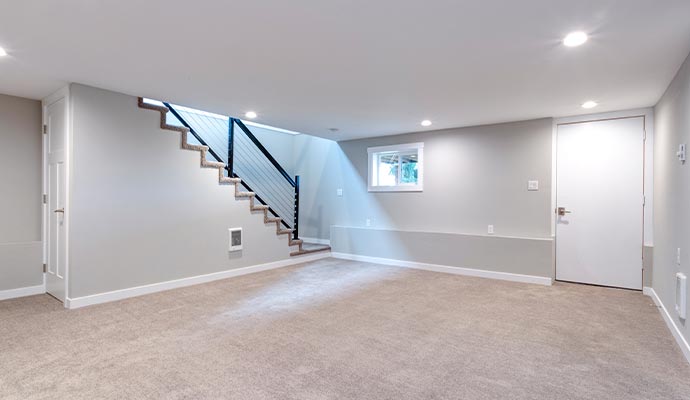 Finished basement with modern stairs