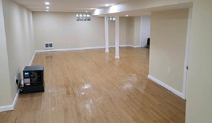 Clean finished basement with installed dehumidifier