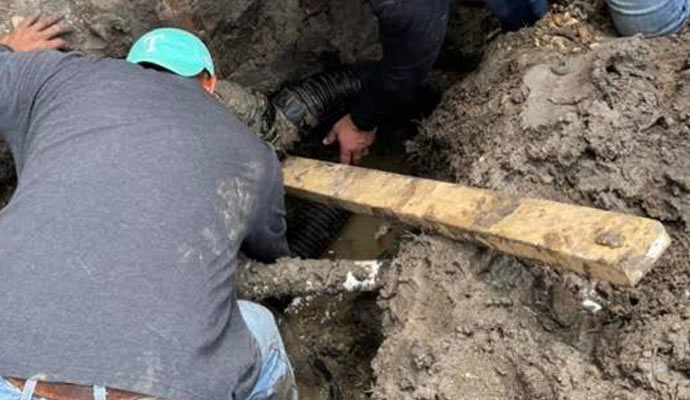 repairing collapsed clogged drain tile